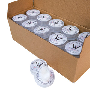 Cardboard box filled with containers labeled 'W', with a few containers spilled out.