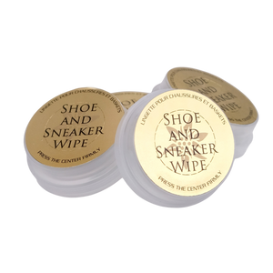 Three containers of 'Shoe and Sneaker Wipe' on a white background
