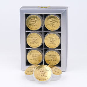 Set of unscented hand and face wipes in a silver box on a white background