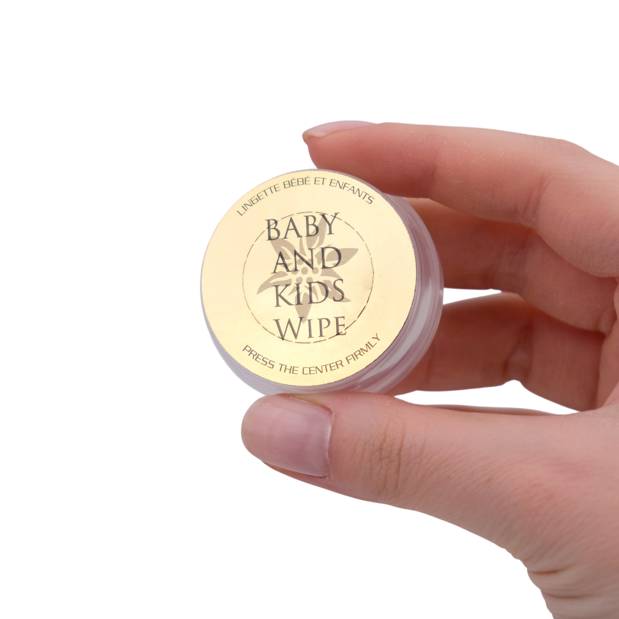 Hand holding a small container labeled 'Baby and Kids Wipe' against a white background