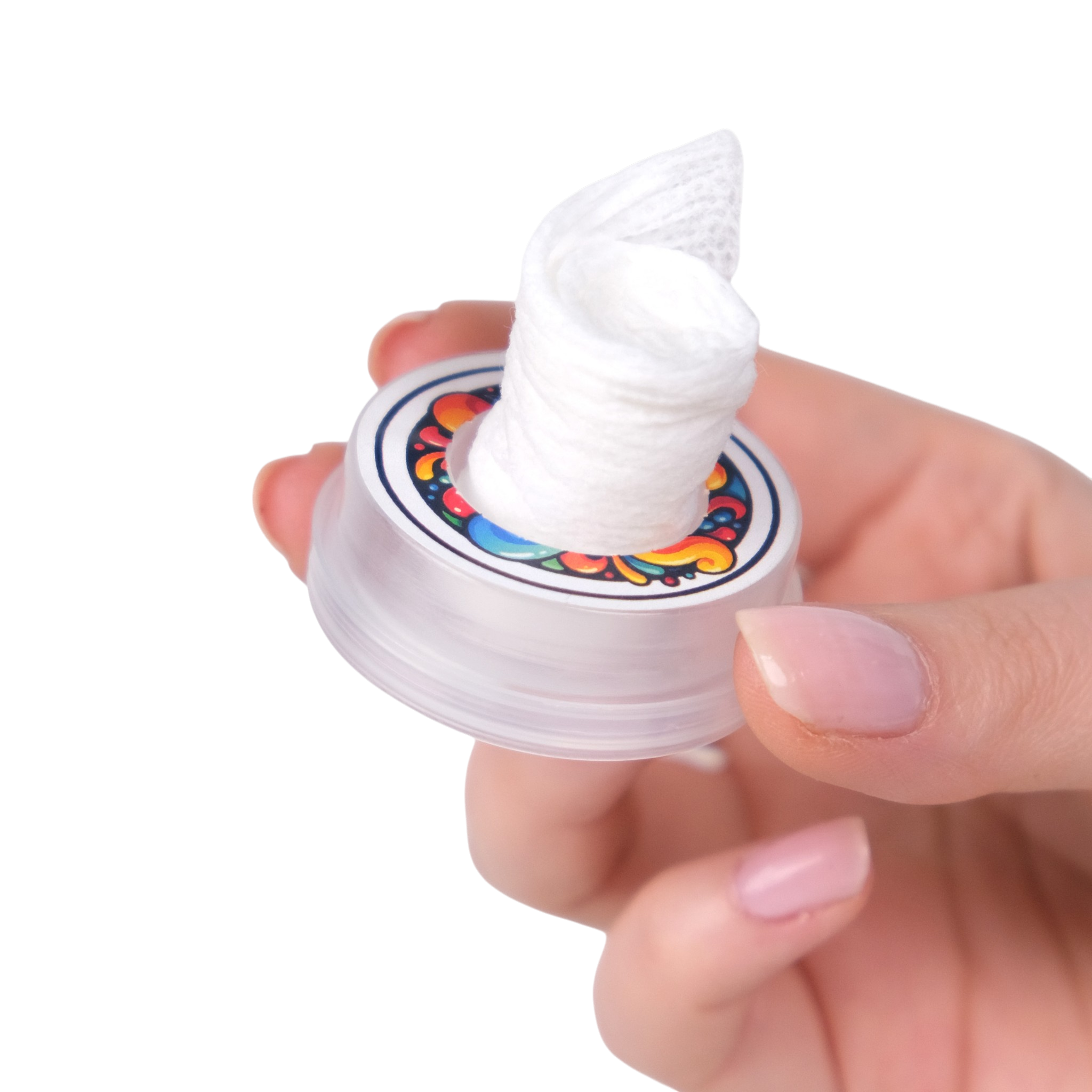 Hand holding a small container with white cream on a white background