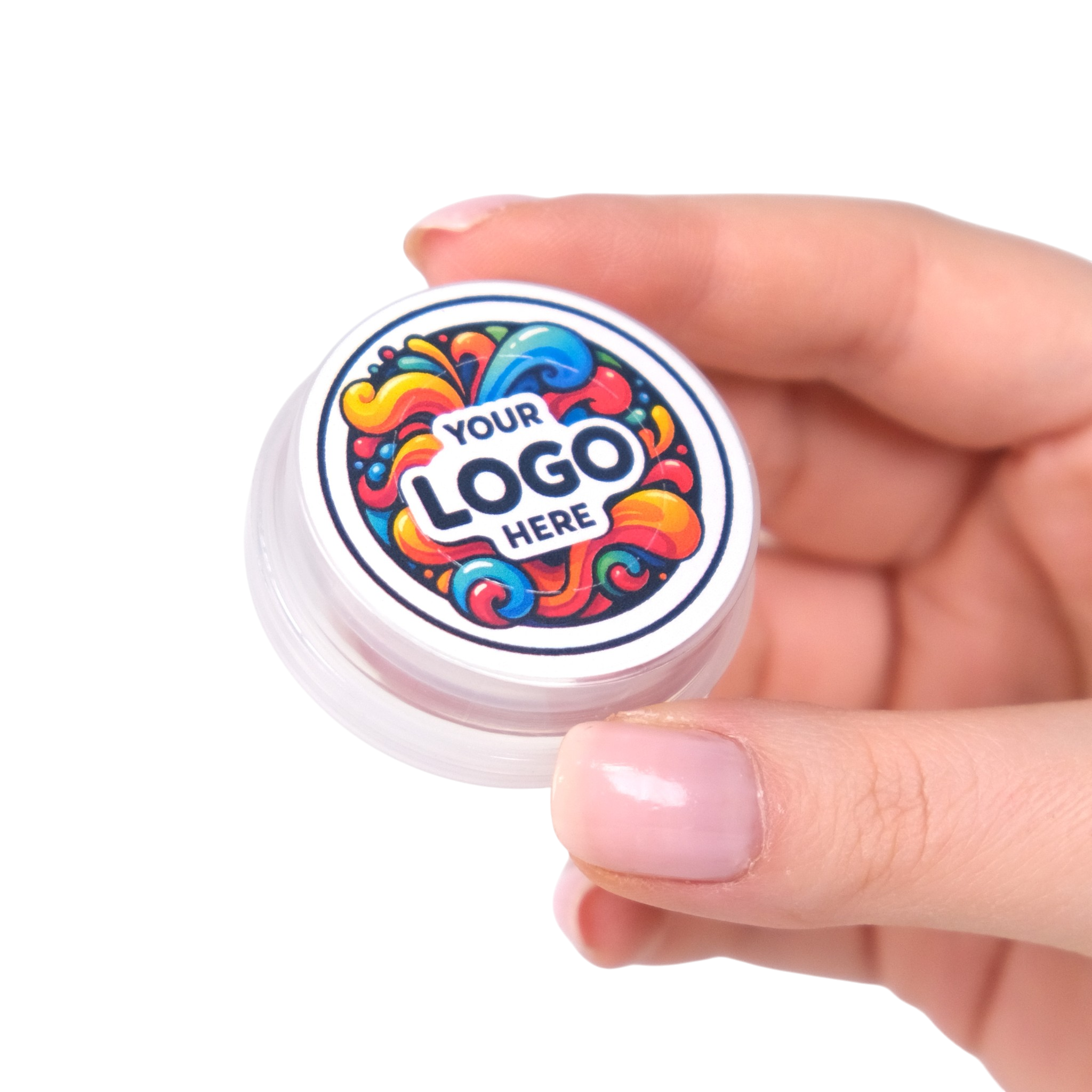 Hand holding a small round container with a colorful logo on a white background