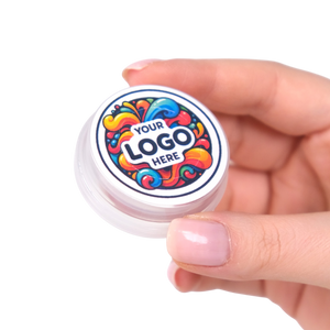 Hand holding a small round container with a colorful logo on a white background