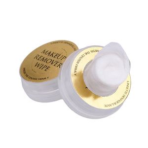 Makeup remover wipes with gold and white design on a light gray background
