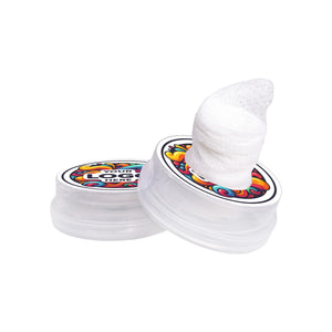 White toy with colorful label on a white background