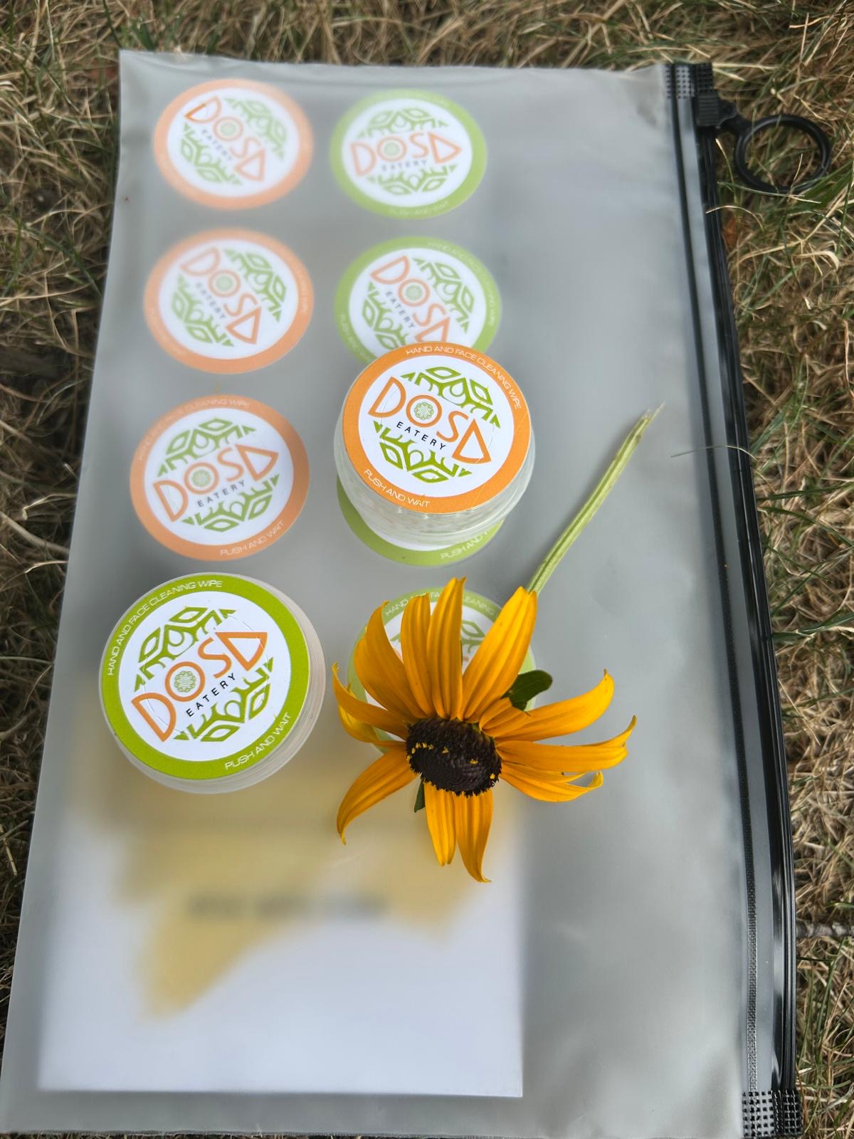 Set of decorative stamps on a clear block with a yellow flower on a grassy background