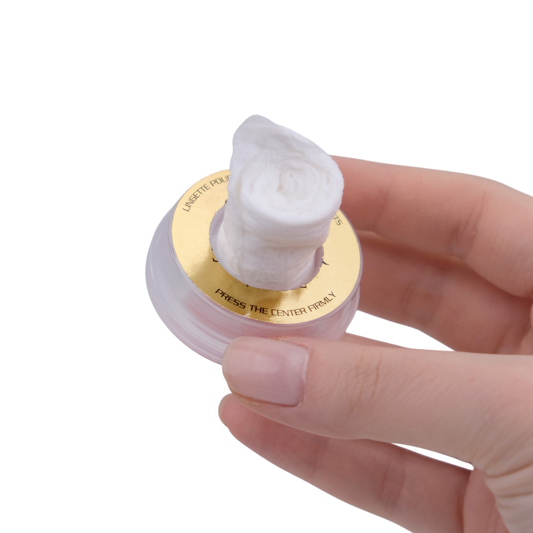 Hand holding a small container with a white applicator on a white background