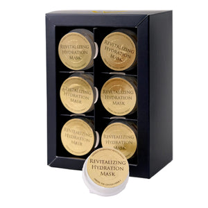 Revitalizing hydration mask packaging with multiple containers in a black box on a white background