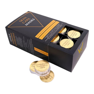 Box of skin care masks with gold containers on a white background
