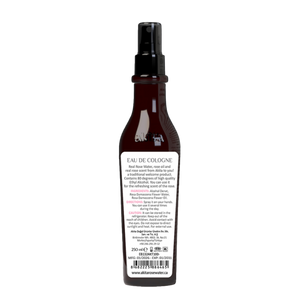 Brown cologne spray bottle with label on a white background