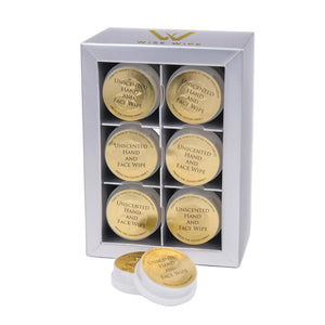 Set of six unscented hand and face wipes in a branded box on a white background