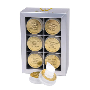 Set of unscented hand and face wipes in a white box with gold labels.