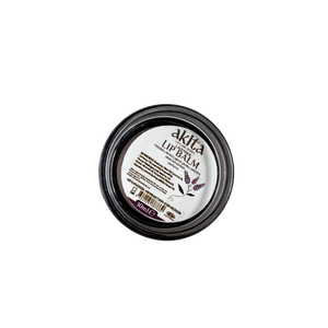 Lip balm container with visible brand label on a white background