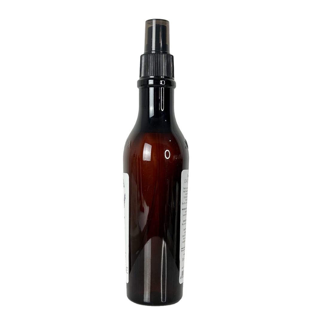 Brown spray bottle with black nozzle on a white background