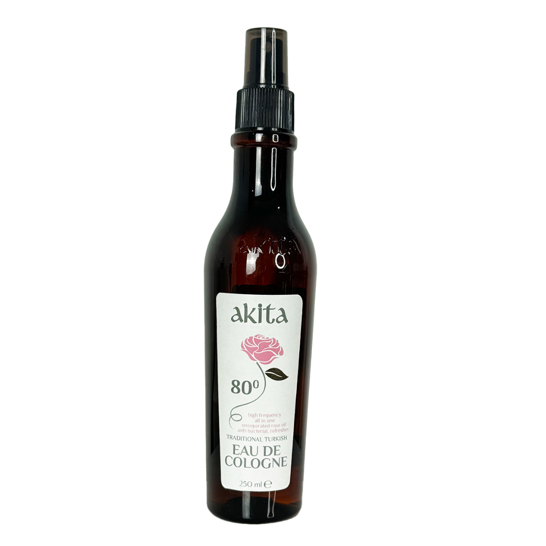Bottle of Akita cologne with a rose on the label against a white background