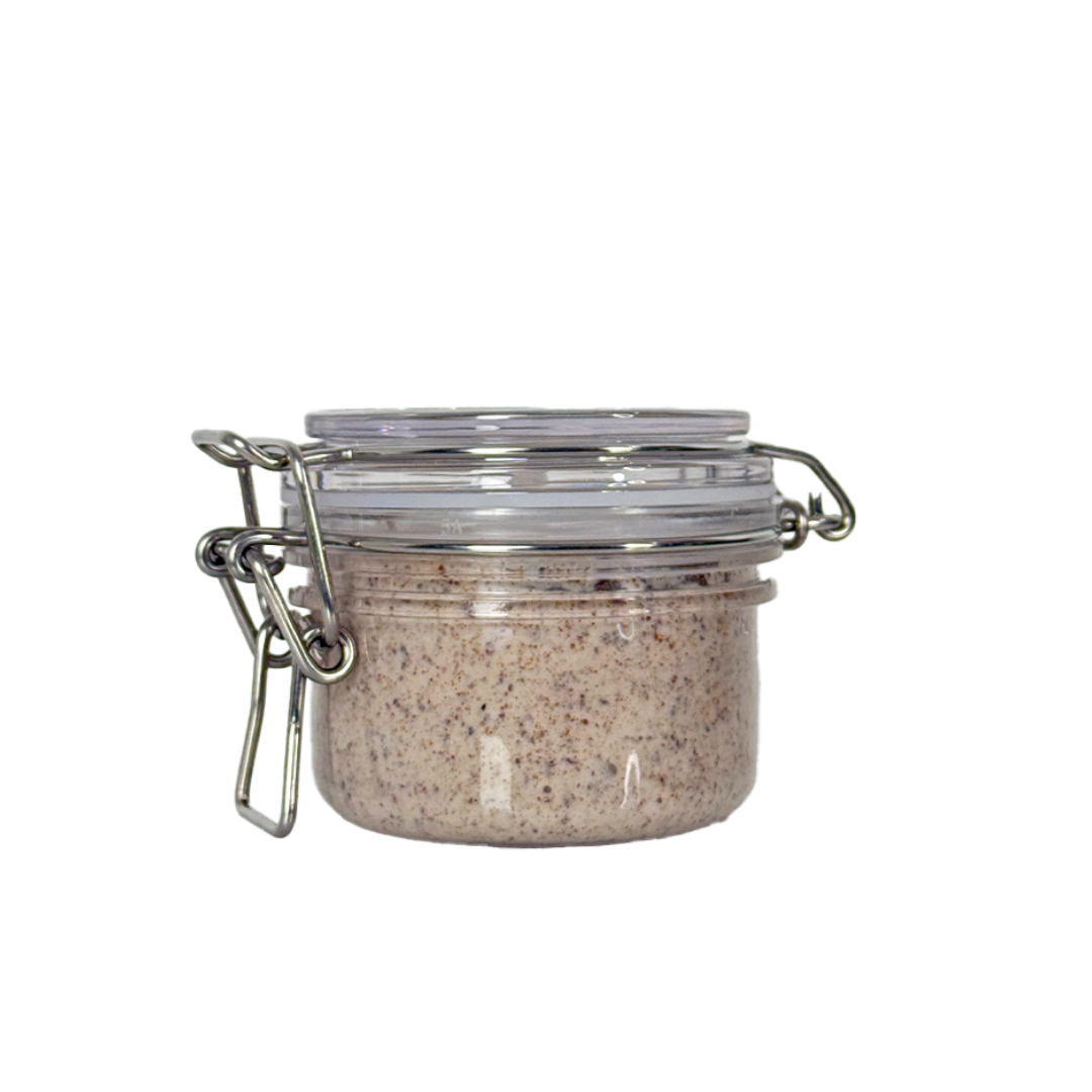 Glass jar with metal clasp on a white background