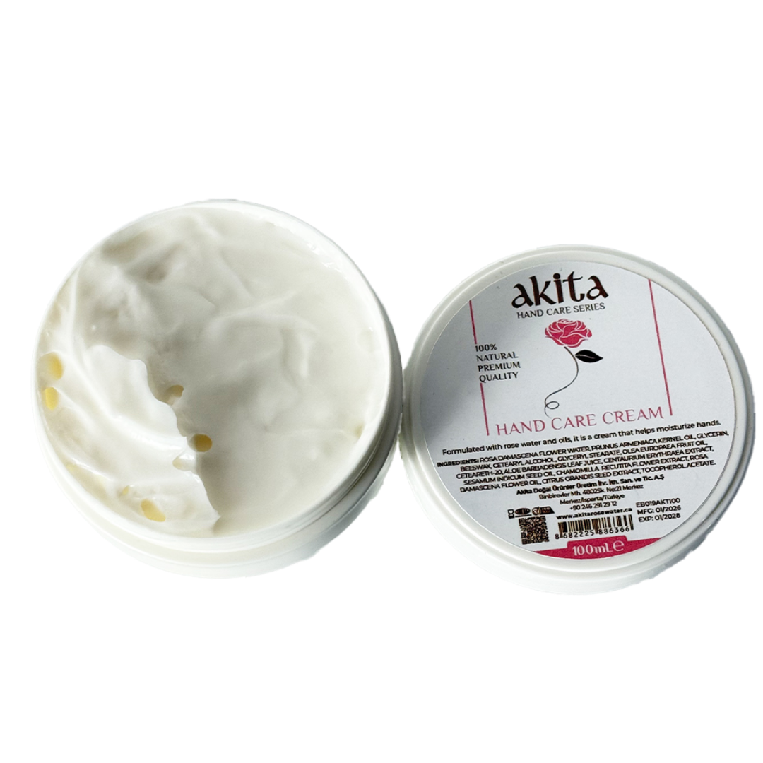 Open jar of hand care cream with visible cream and 'akita' branding on a white background