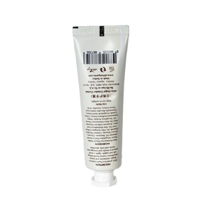 White tube of cream on a white background