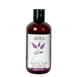Bottle of akita herbal hair shampoo on a white background
