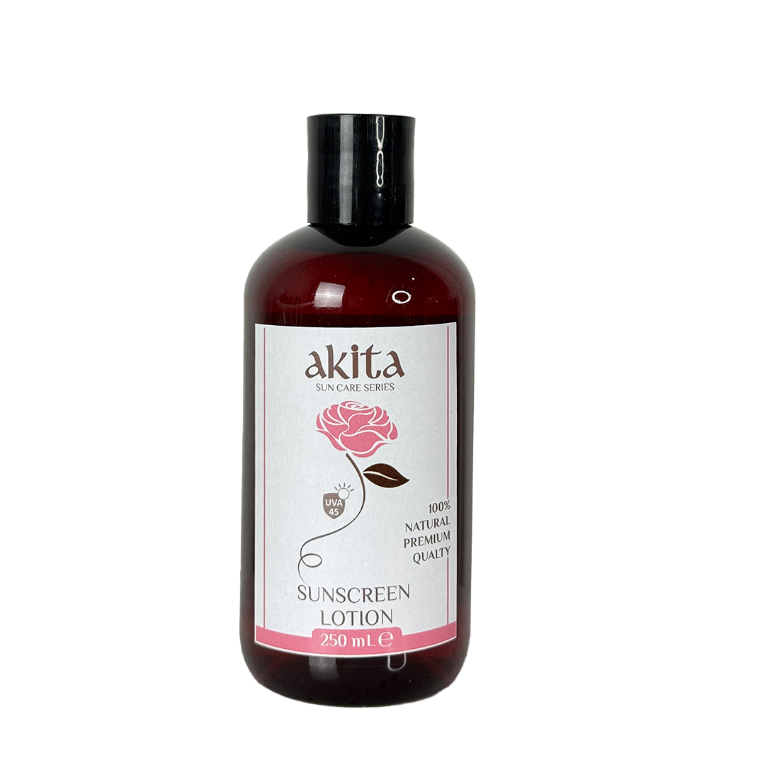 Bottle of Akita sunscreen lotion with a rose design on the label against a white background