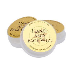 Three containers of hand and face wipes with gold labels on a white background