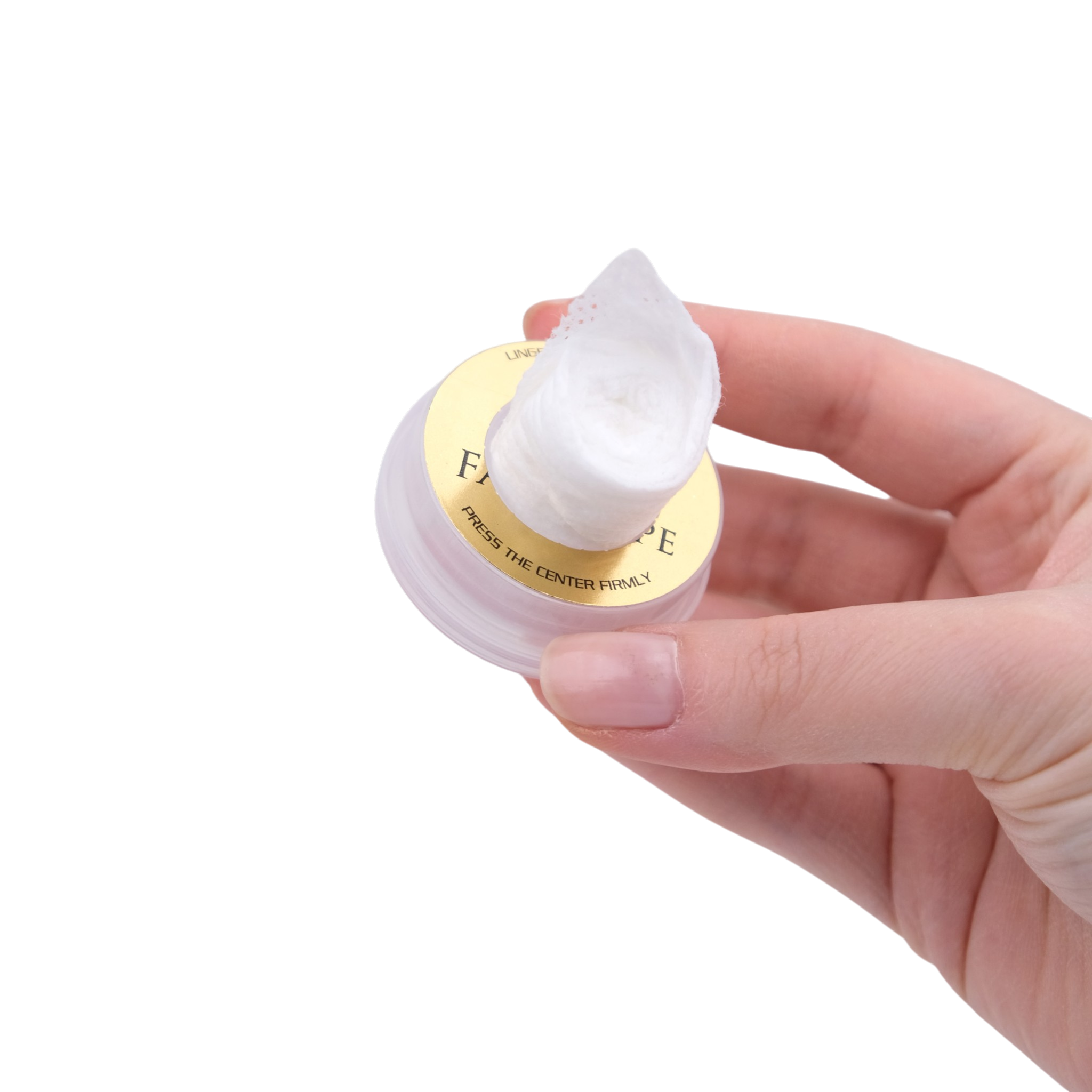 Hand holding a small container of cream with a visible brand name on a white background