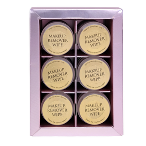 Set of six makeup remover wipes in a pink box