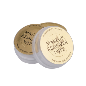 Makeup remover wipes with gold and white packaging on a white background