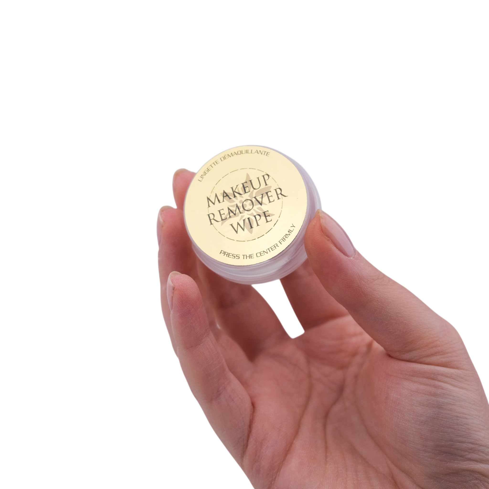 Makeup remover wipe container held in a hand on a white background