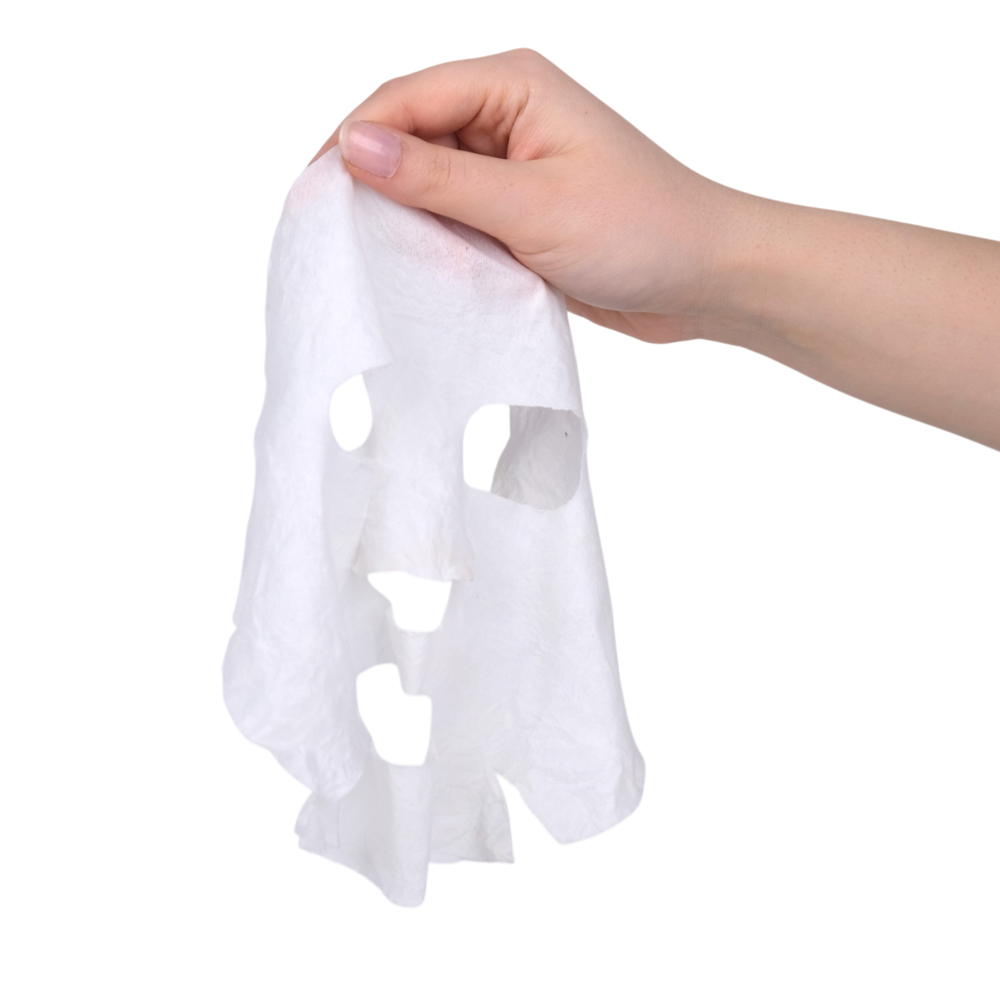 Hand holding a white paper towel with cut-out shapes on a white background