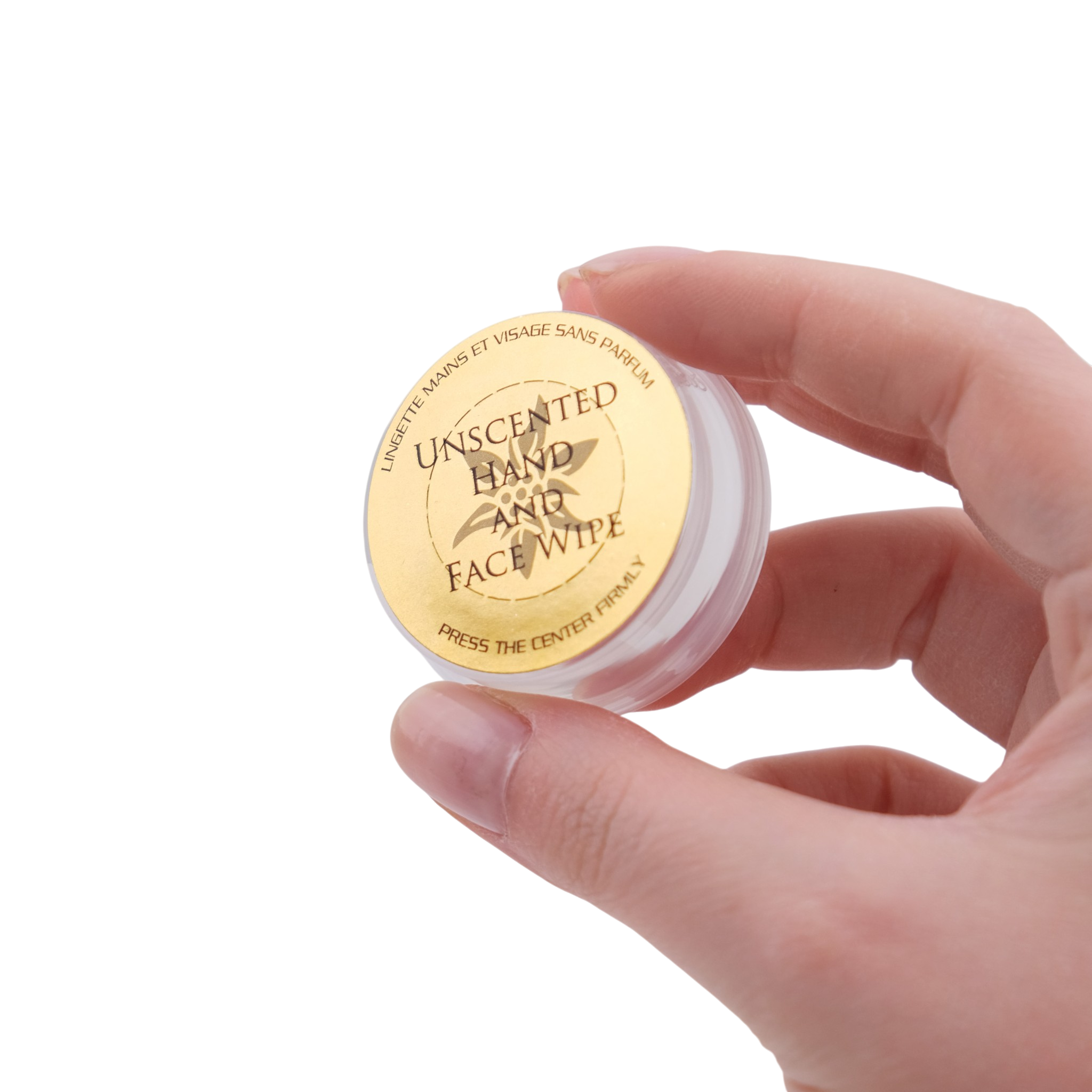 Hand holding a small container of unscented hand and face wipes with a gold lid.